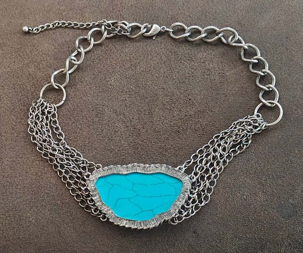 Silver Tone Multi Strand Chain Statement Necklace With a Faux Turquoise Stone