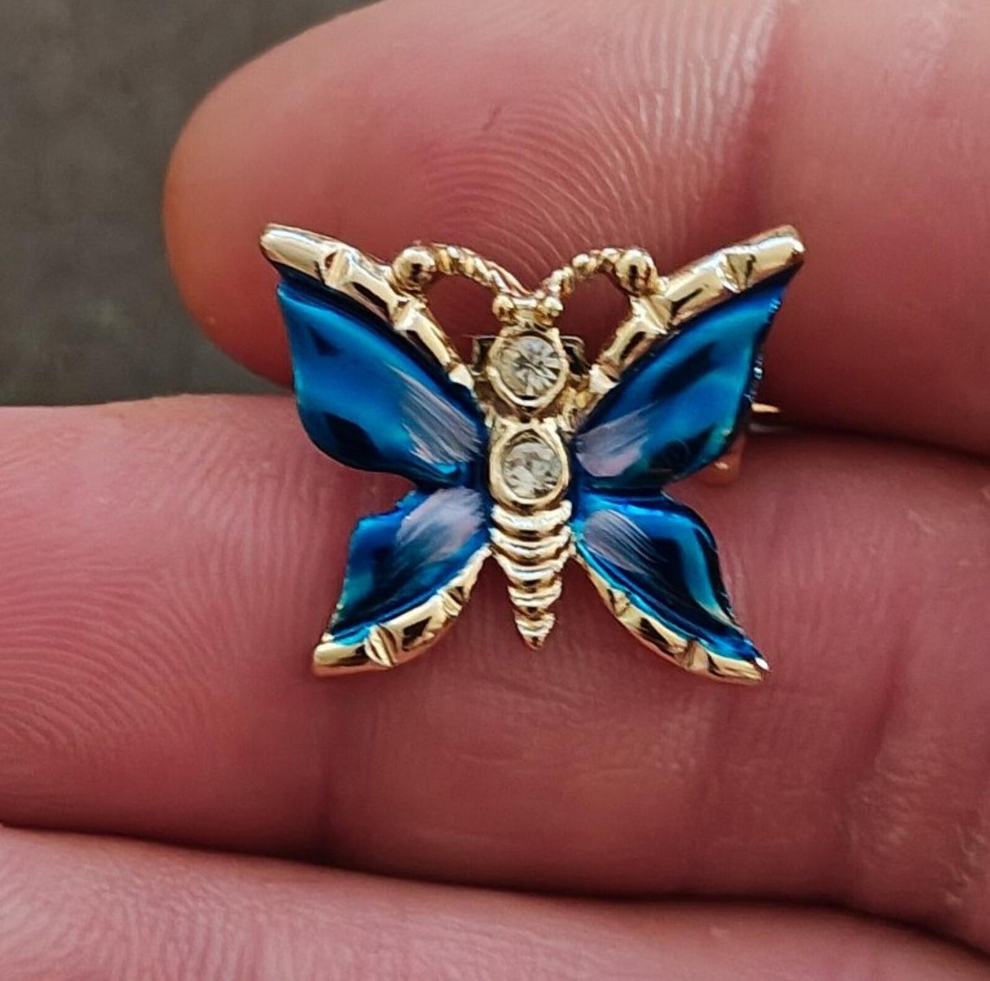 1980s Gold Tone Blue Enamel Butterfly Brooch Accented With Clear Rhinestones
