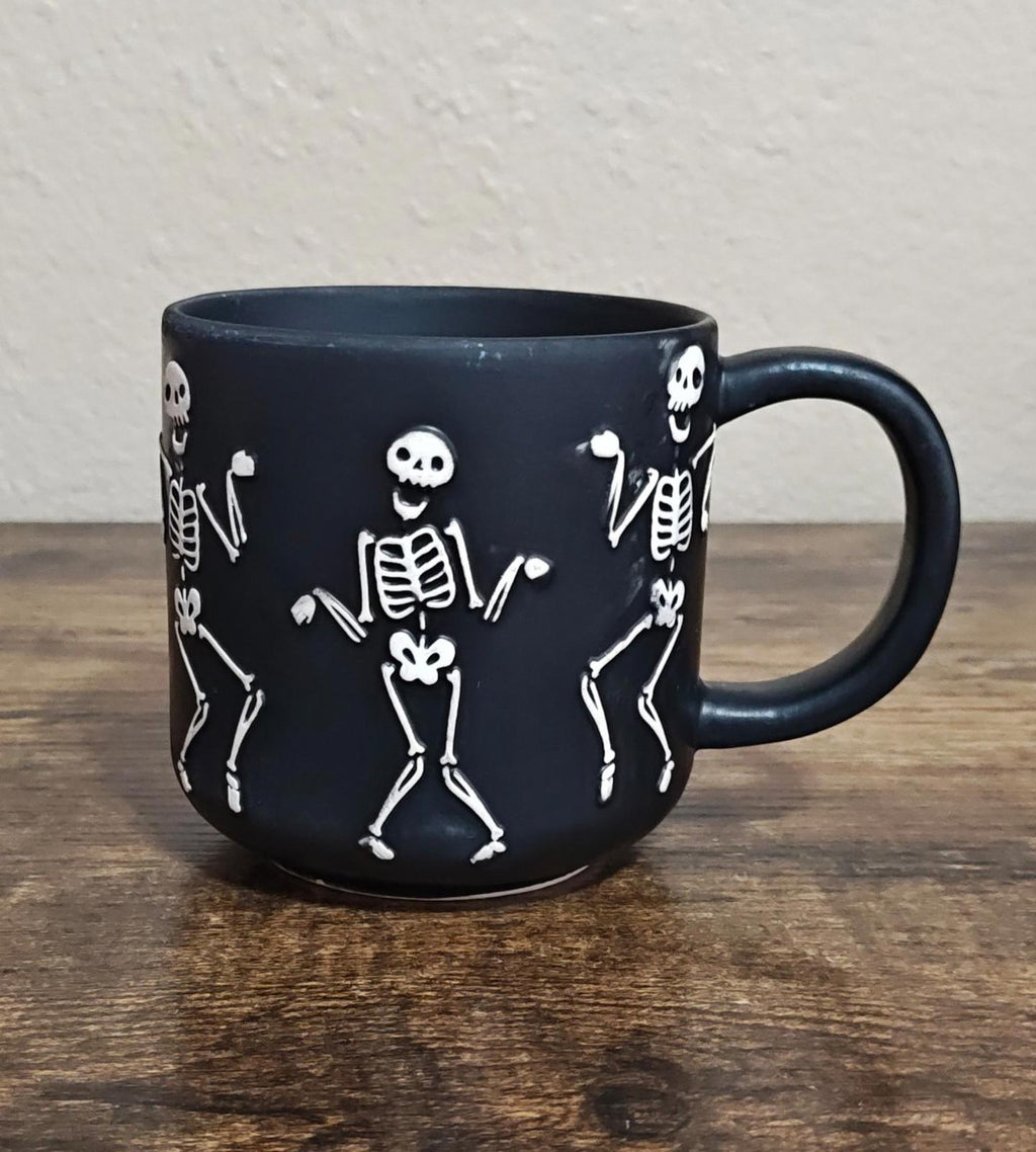 Dancing Skeletons Black Earthenware 13 oz 3D Embossed Black Mug.