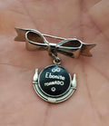 Silver tone bowling ball dangle brooch with ribbon bow and Ebonite Tornado medallion