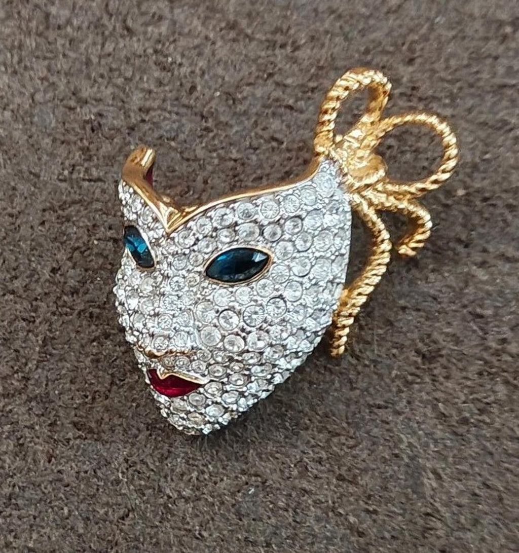 Swarovski gold-tone masquerade mask brooch with pave crystals and colored stones