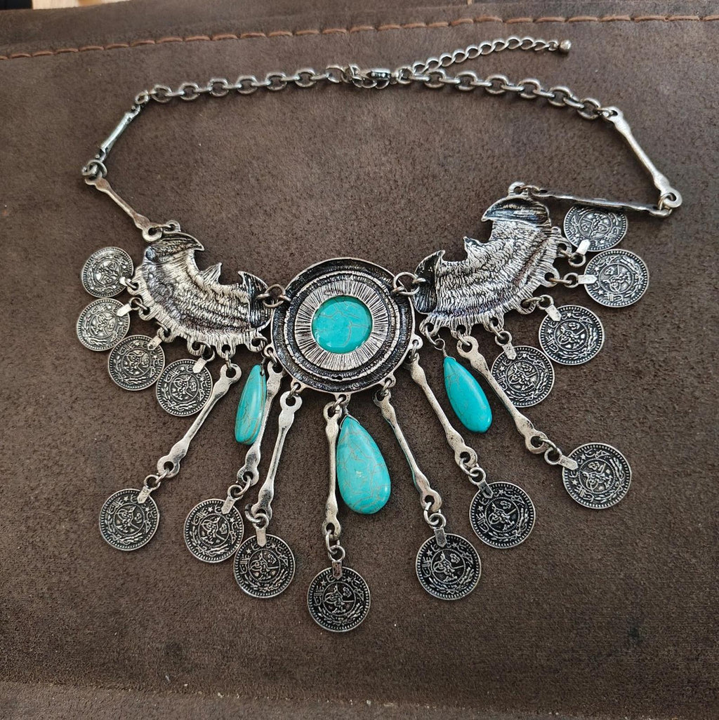 Silver-tone boho bib necklace with turquoise round center and dangling teardrop charms