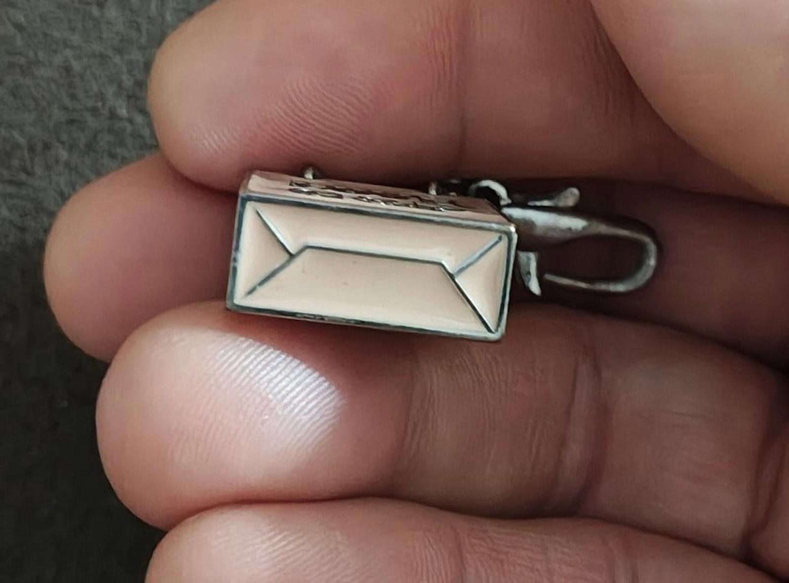 Juicy Couture bag charm metal rectangle back with lobster clasp and chain