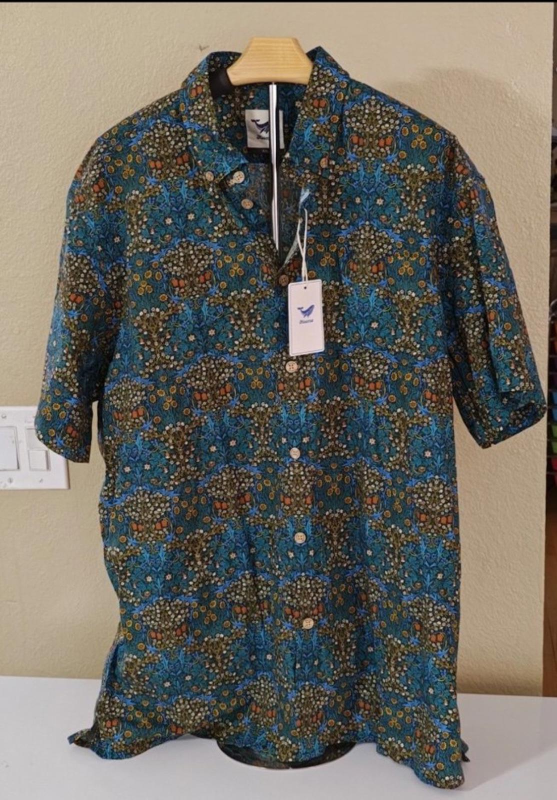 Men's blue floral short-sleeve Hawaiian shirt, front view with hanging neck tag and placket