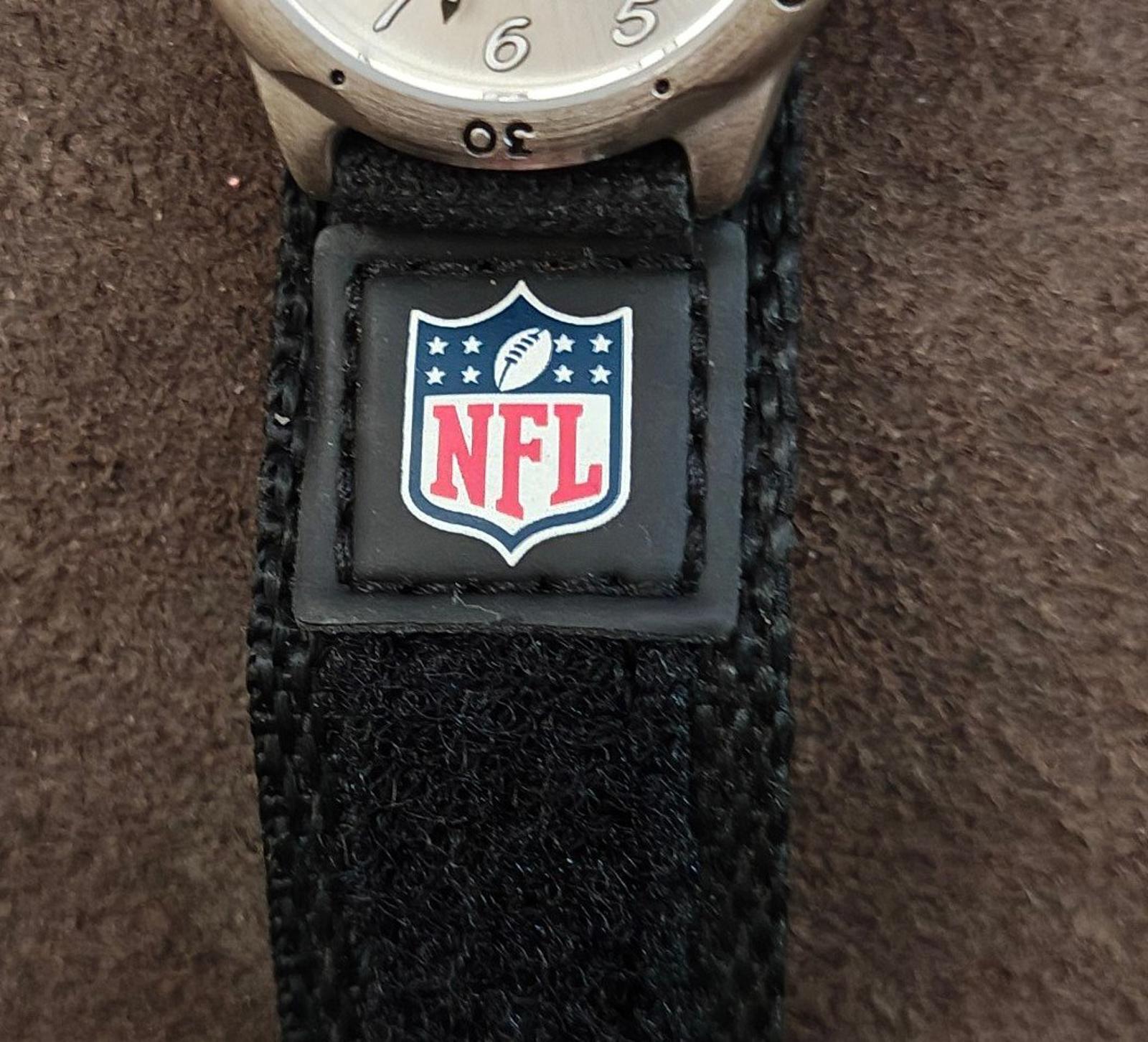 Black nylon watch strap close-up with NFL shield patch