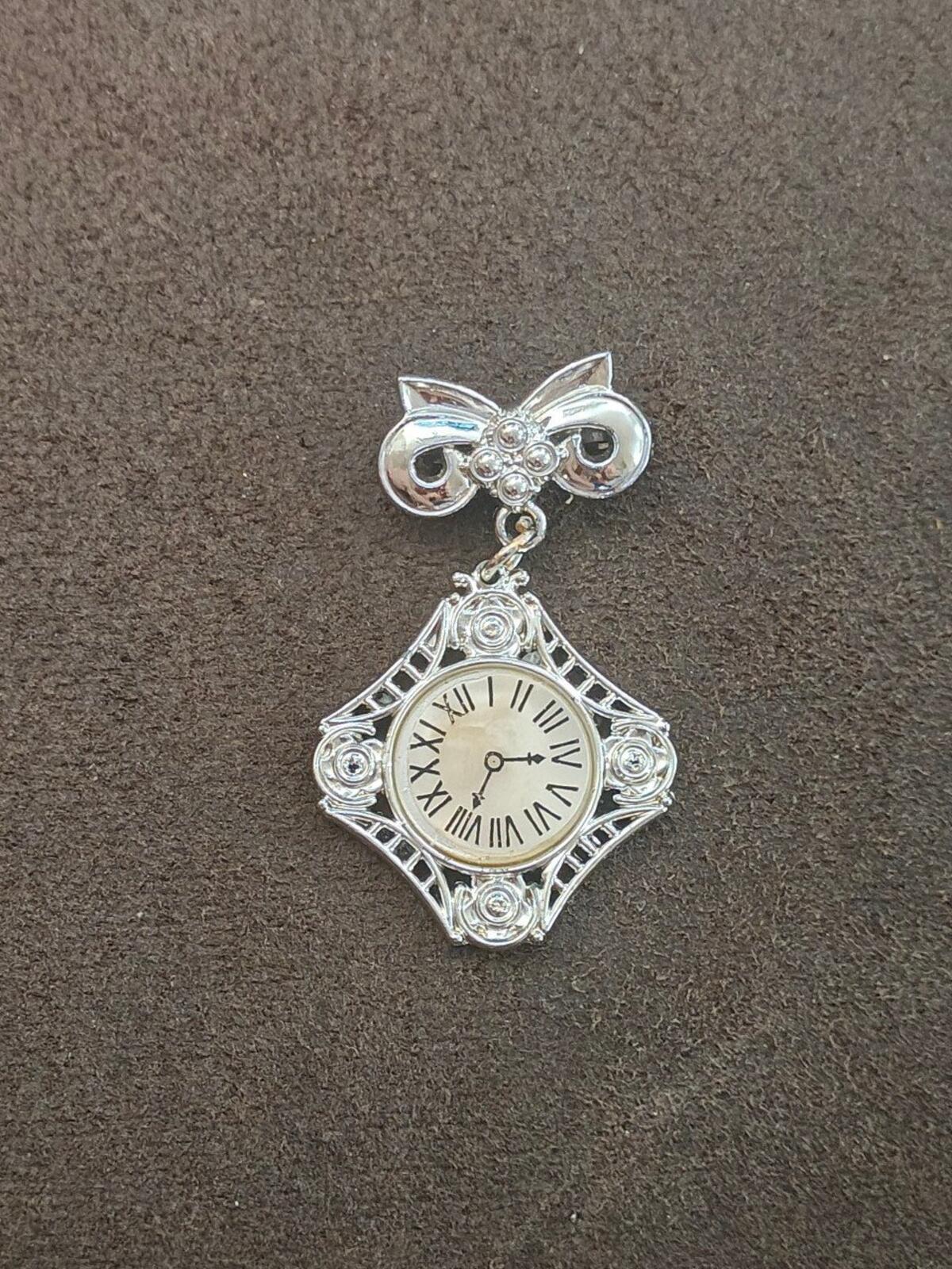 1980s Silver Tone Art Deco Style Bow Clock Motif Dangle Brooch