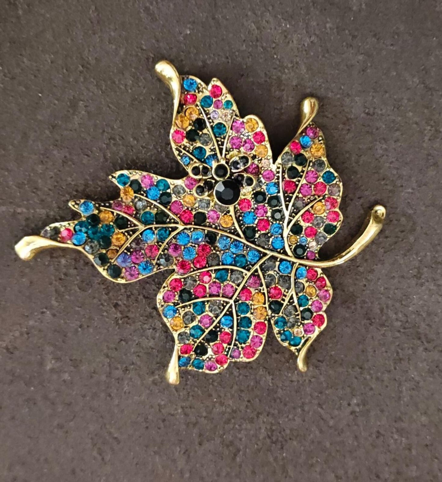 1980s Gold Tone Maple Leaf With Multi Colored Rhinestones Brooch