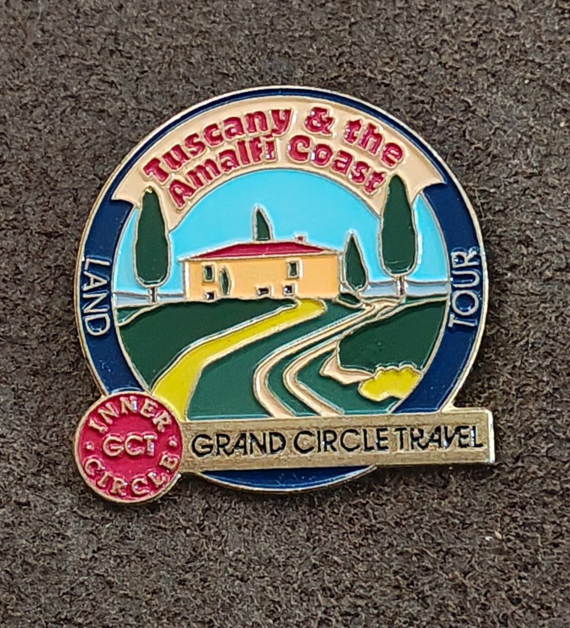 Grand Circle Travel Inner Circle Gold Tone Enamel Pin