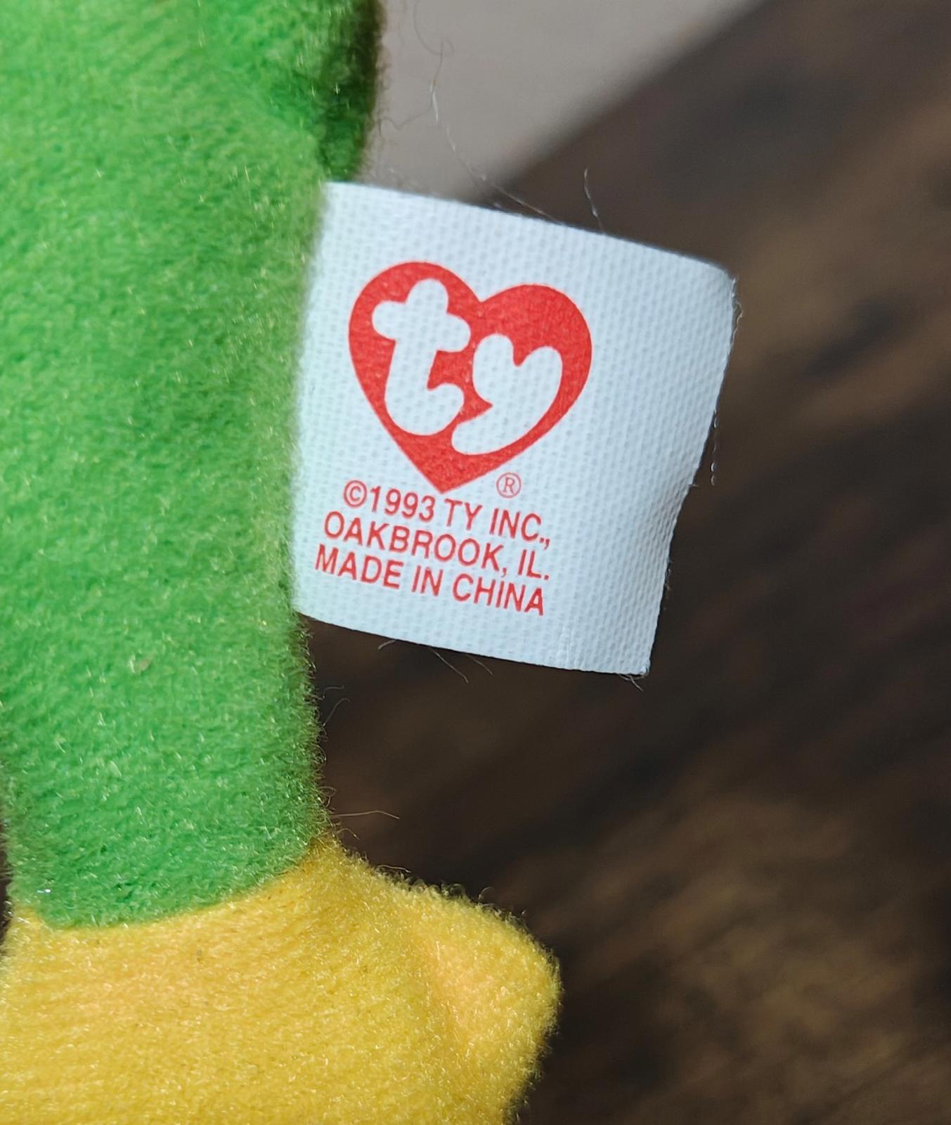 Green plush frog with white Ty tag showing 'Made in China'