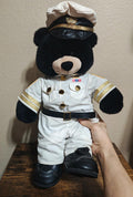 Black bear plush in white navy officer uniform with captain hat and black boots