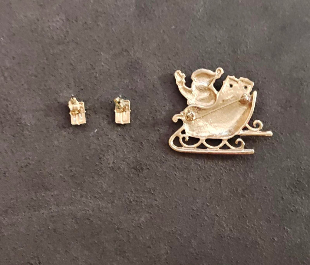 Gold-tone Santa sleigh brooch plus two small red-and-green enamel stud earrings