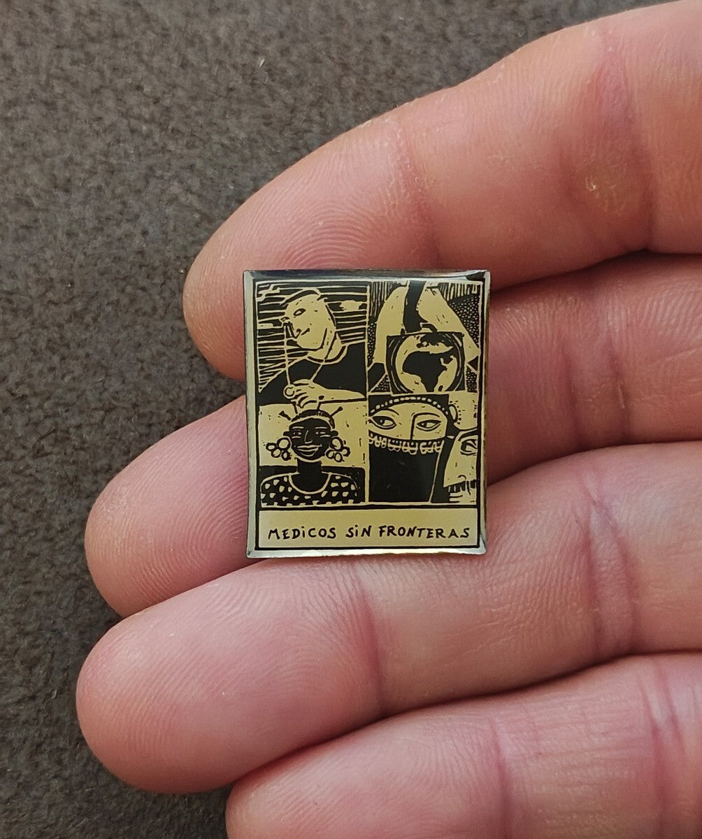 1990s Médicos Sin Fronteras (Doctors Without Borders) Silver Tone Enamel Pin