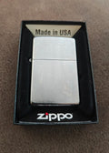 Silver Zippo windproof lighter in black gift box, with “Made in USA” label.