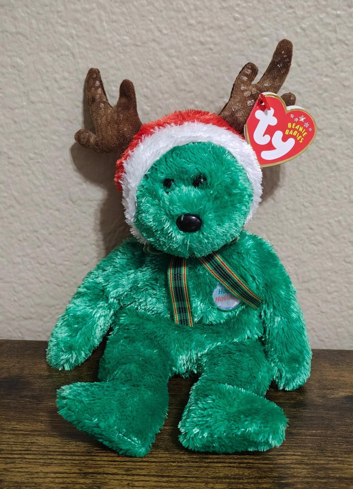 Green plush reindeer teddy bear with antlers and plaid scarf, TY hang tag