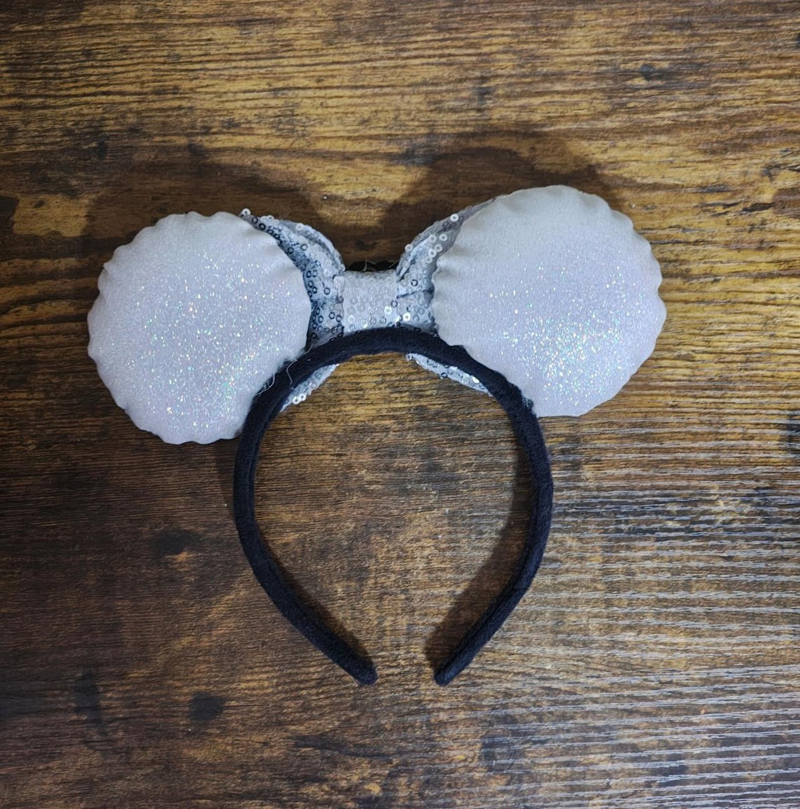 Silver glitter bow headband with black center band and large round ears