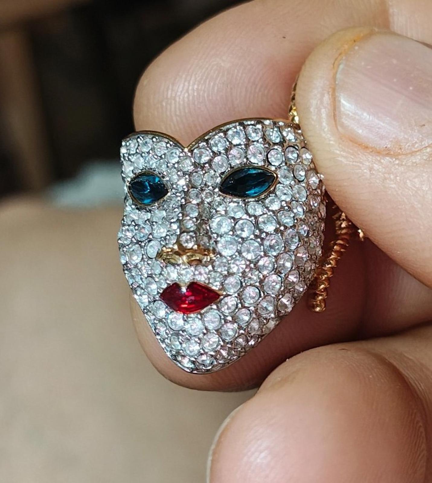 Swarovski gold-tone masquerade mask brooch with clear crystals, blue eyes, red lips