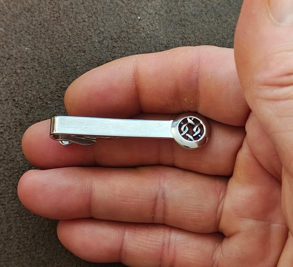 Silver tie bar clip with round Celtic knot medallion end on bar