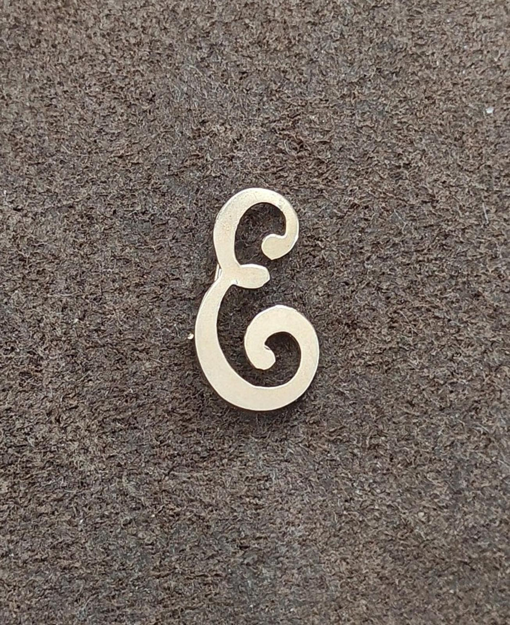 Gold tone monogram letter E brooch pin with scroll cutout details