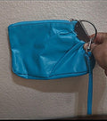 Teal PVC leather-style clutch purse with zipper and wrist strap, silver-tone keyring hardware