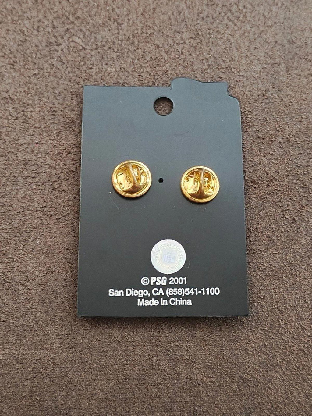 Back of PSG 2001 enamel pin card with two gold tone posts