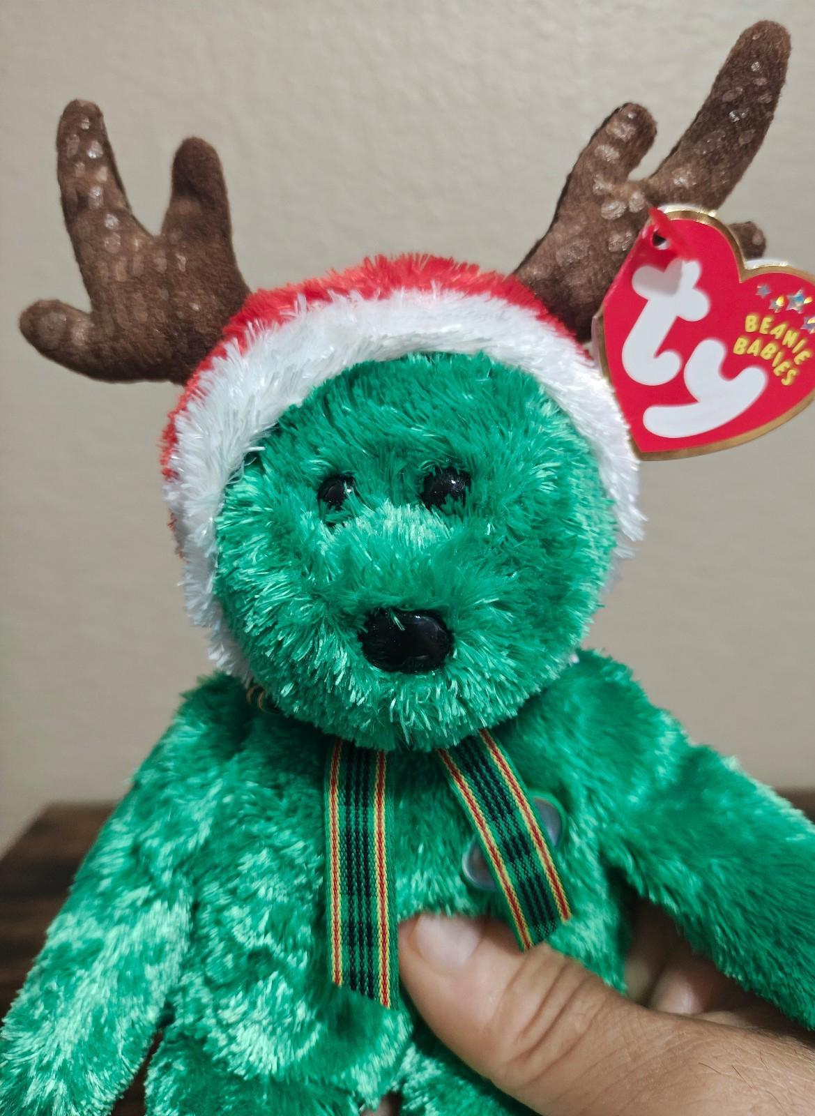 Green plush reindeer teddy bear with white-trim antlers and TY hang tag