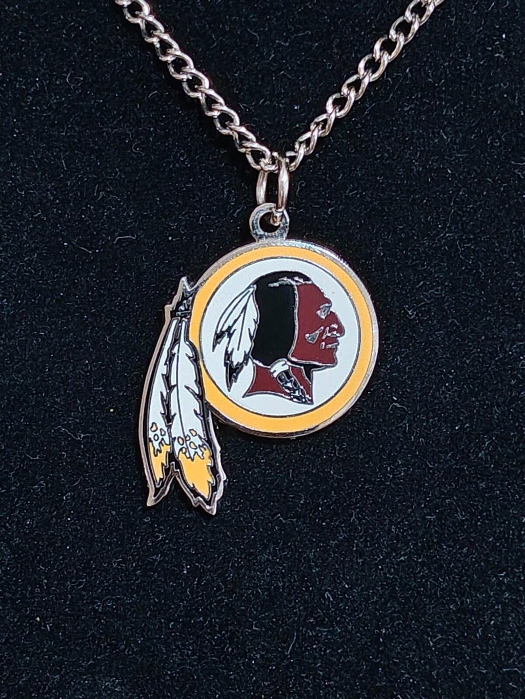 Round team logo pendant necklace with feather charm on a silver chain