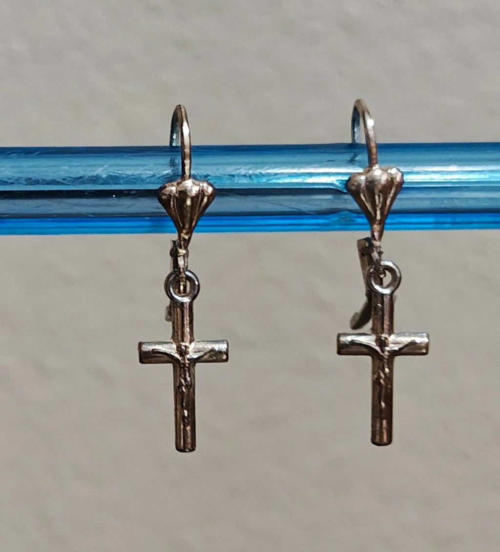 Silver-tone cross dangle earrings with heart charm tops and hook backs.