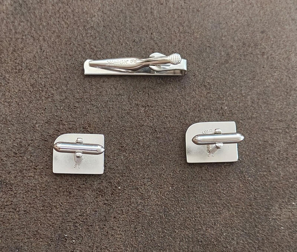 Silver tie bar clip and cufflinks showing bar ends and hinge backs
