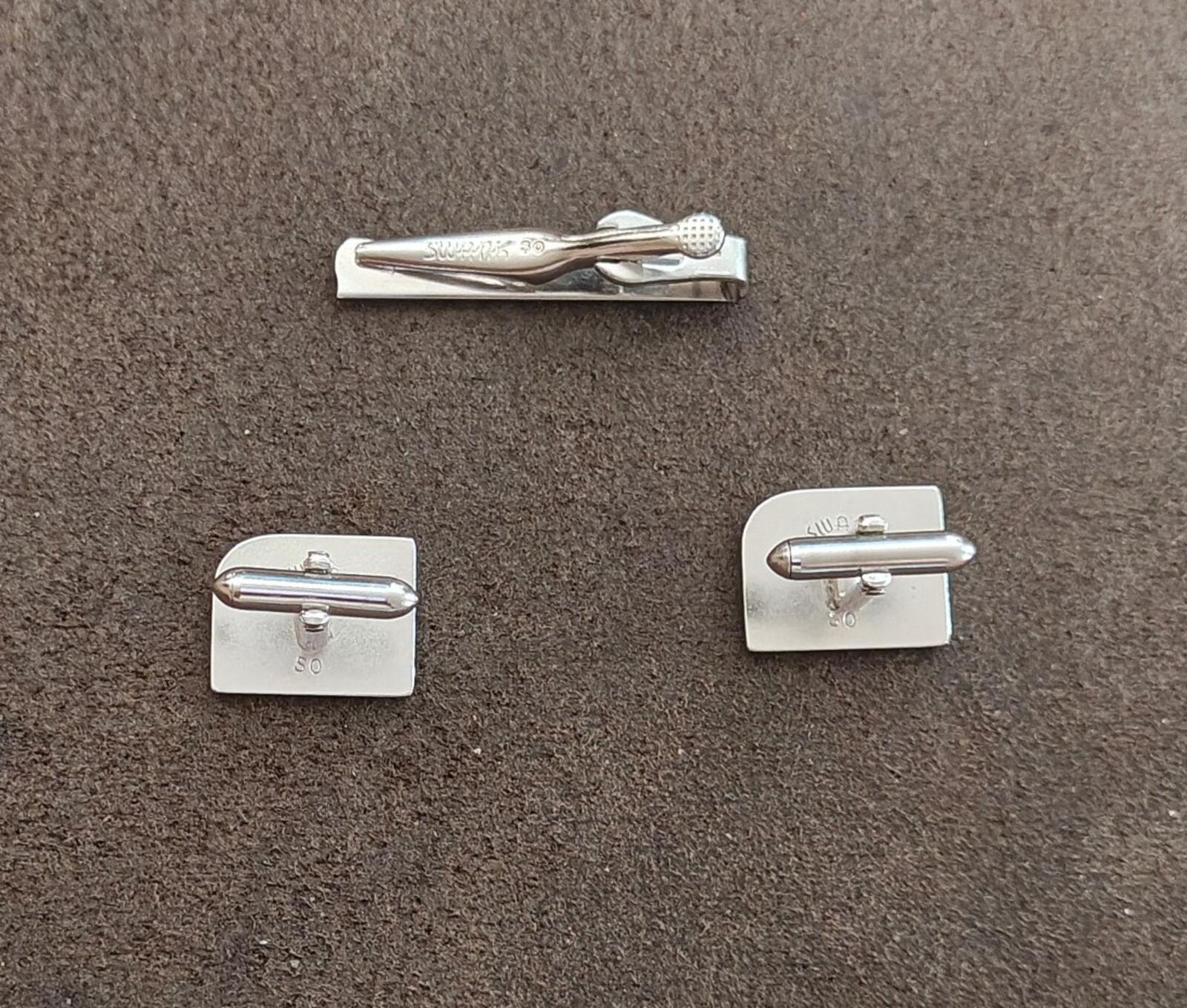 Silver tie bar clip and cufflinks showing bar ends and hinge backs