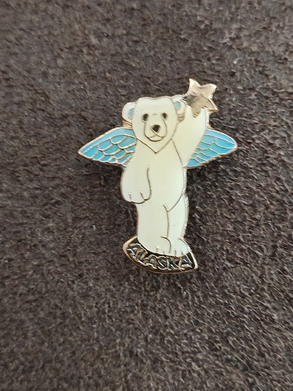 1980s Alaskan Polar Bear Guardian Angel Gold Tone Enamel Pin.