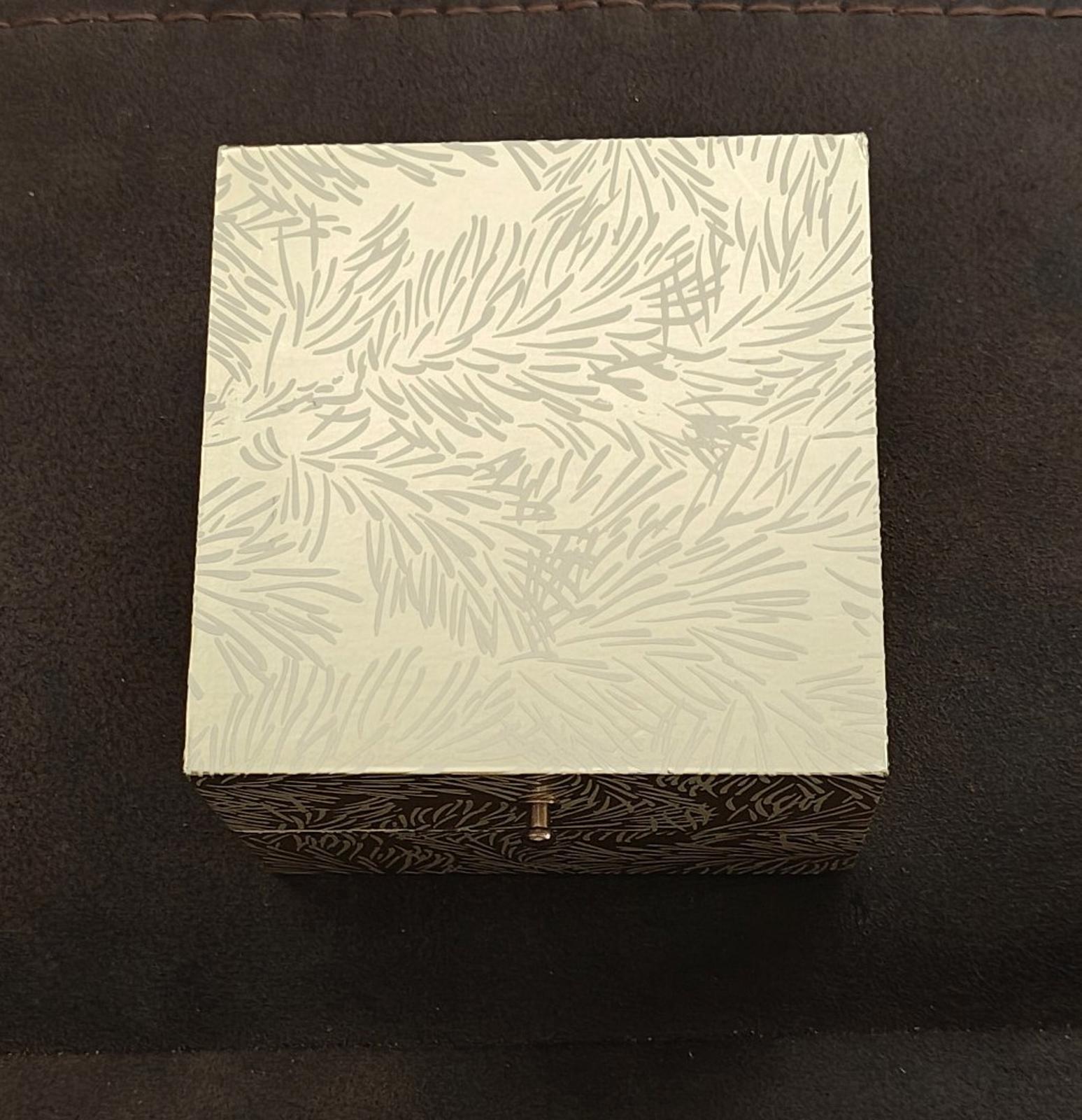 Closed Folio patterned gift box for women’s silver-tone watch set