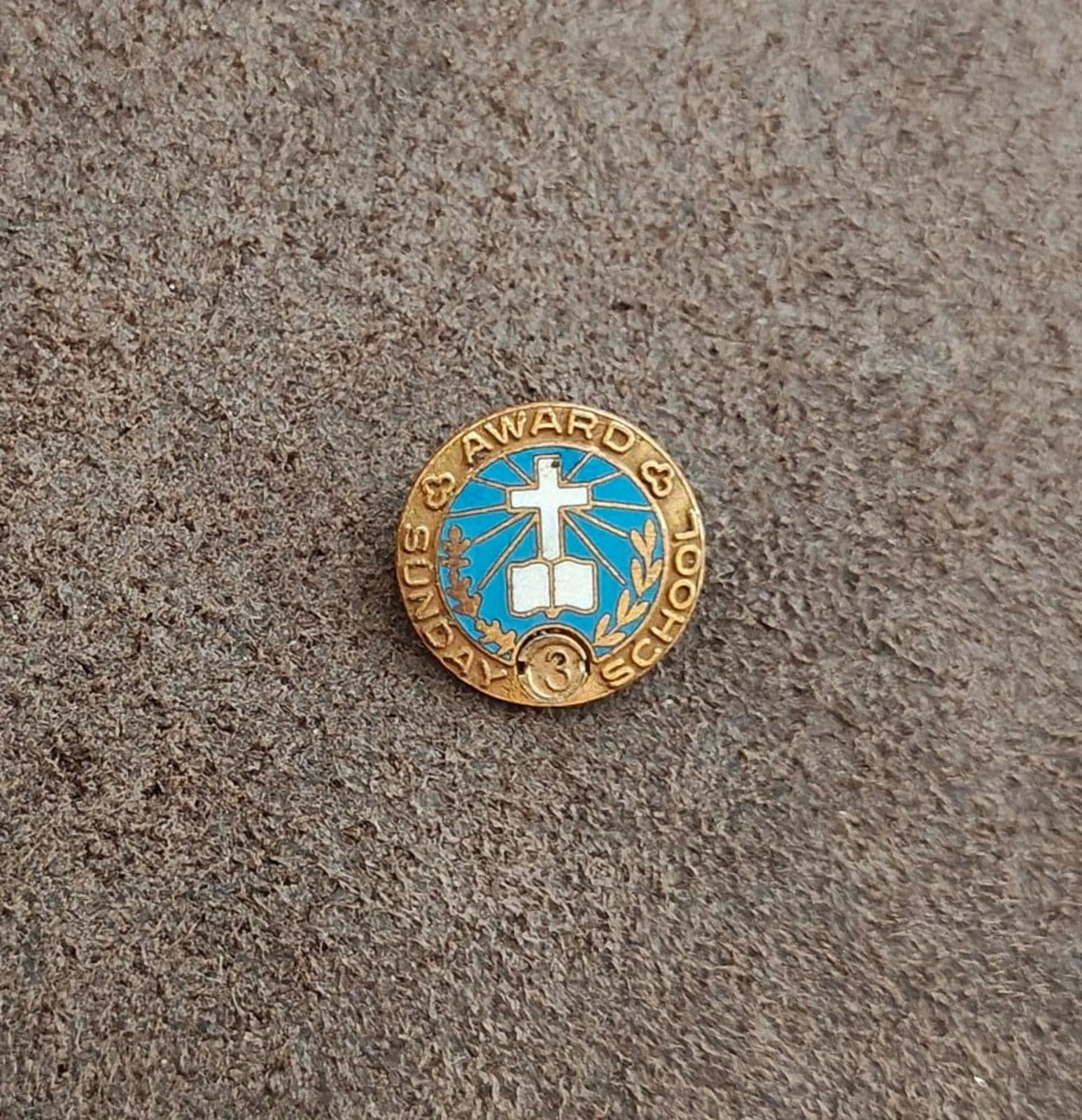 Gold-tone vintage award pin with blue enamel center cross and small "3" medallion