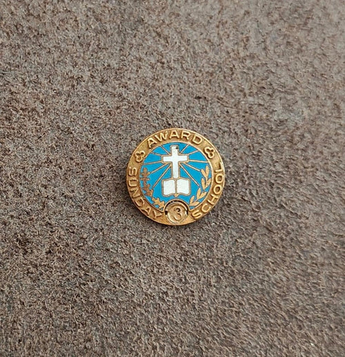 Gold-tone vintage award pin with blue enamel center cross and small "3" medallion