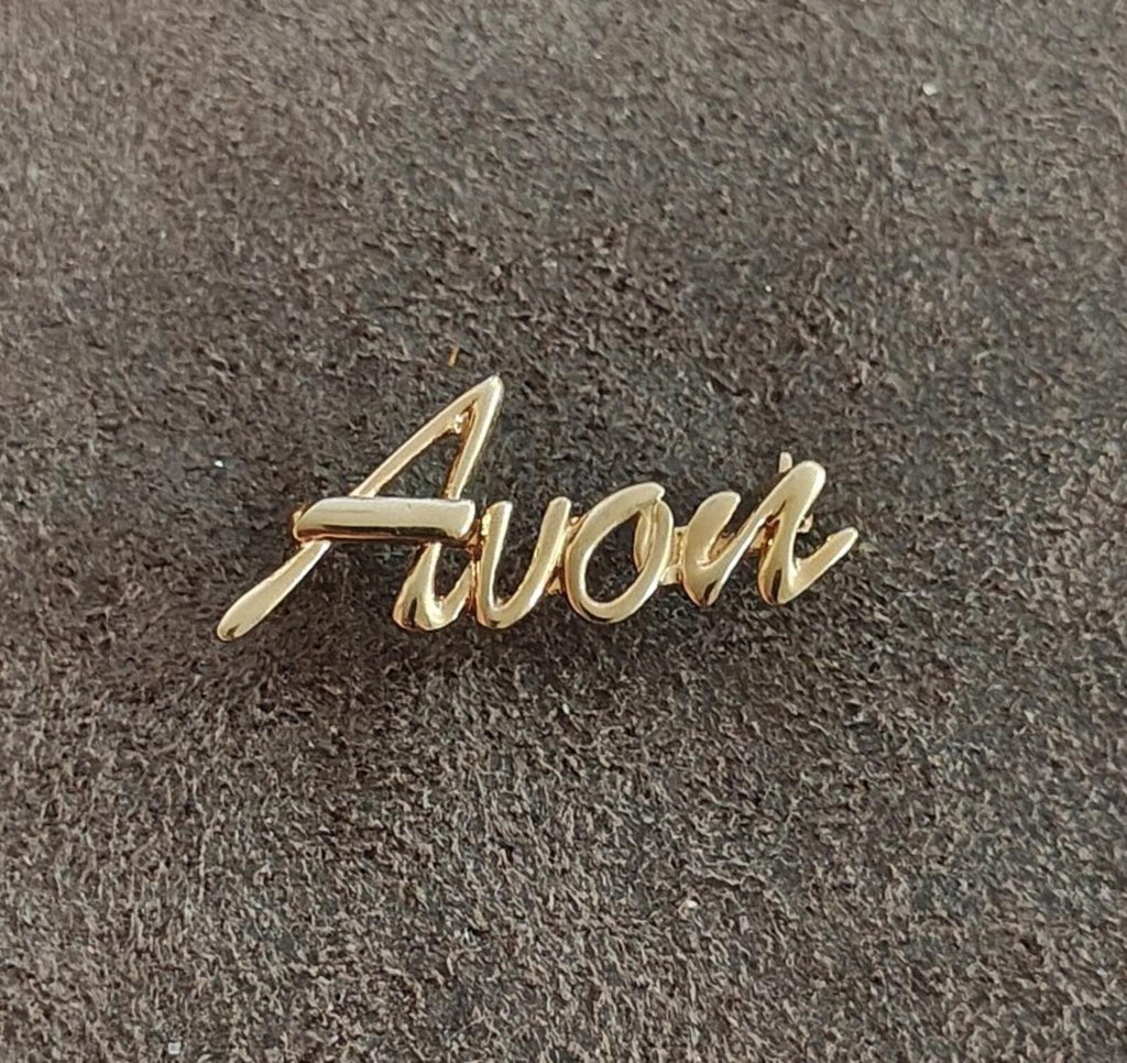 1980s/90s  Avon Gold Tone Cursive Logo Pin