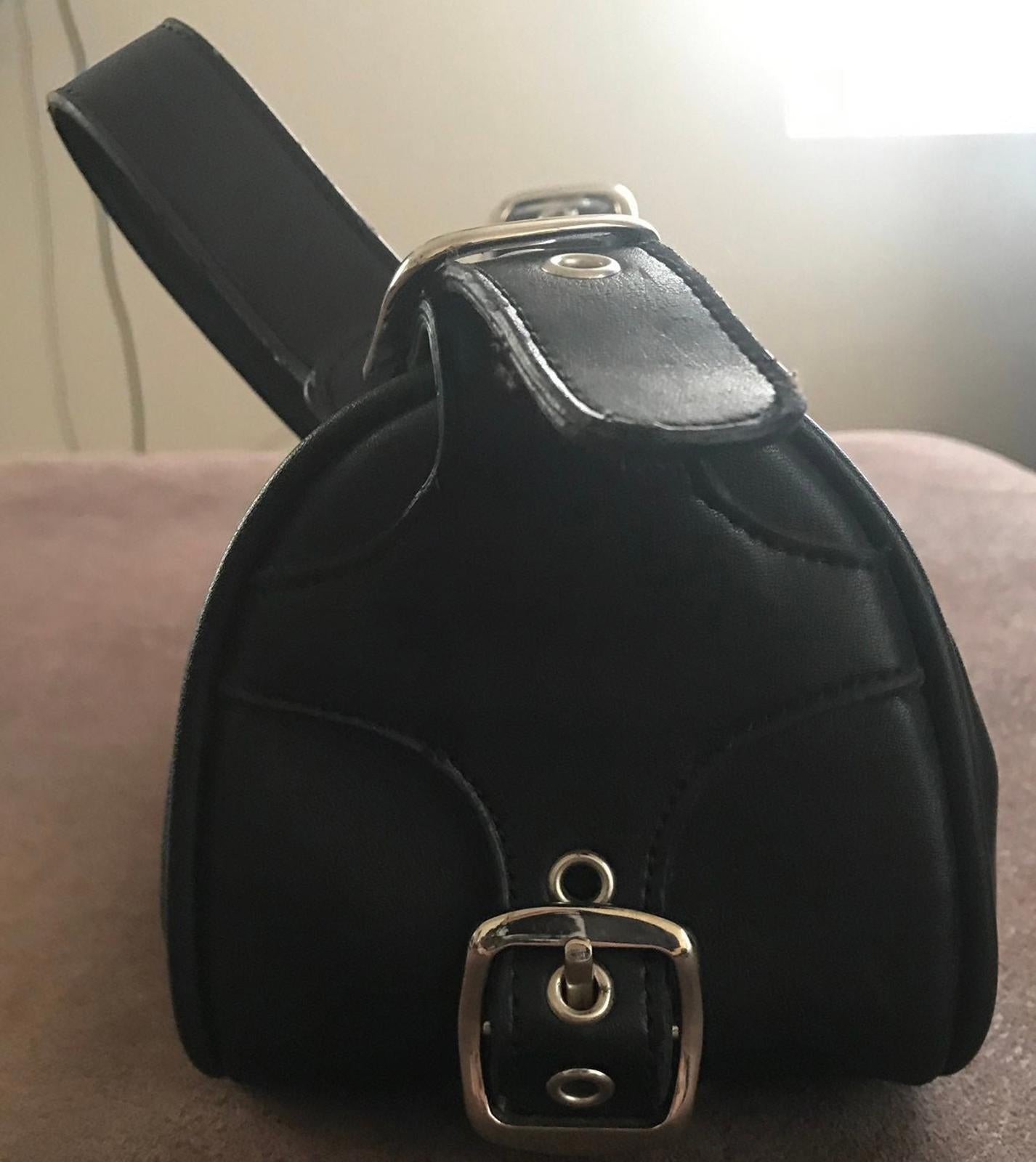 Black leather small shoulder bag with front buckle clasp and wide shoulder strap