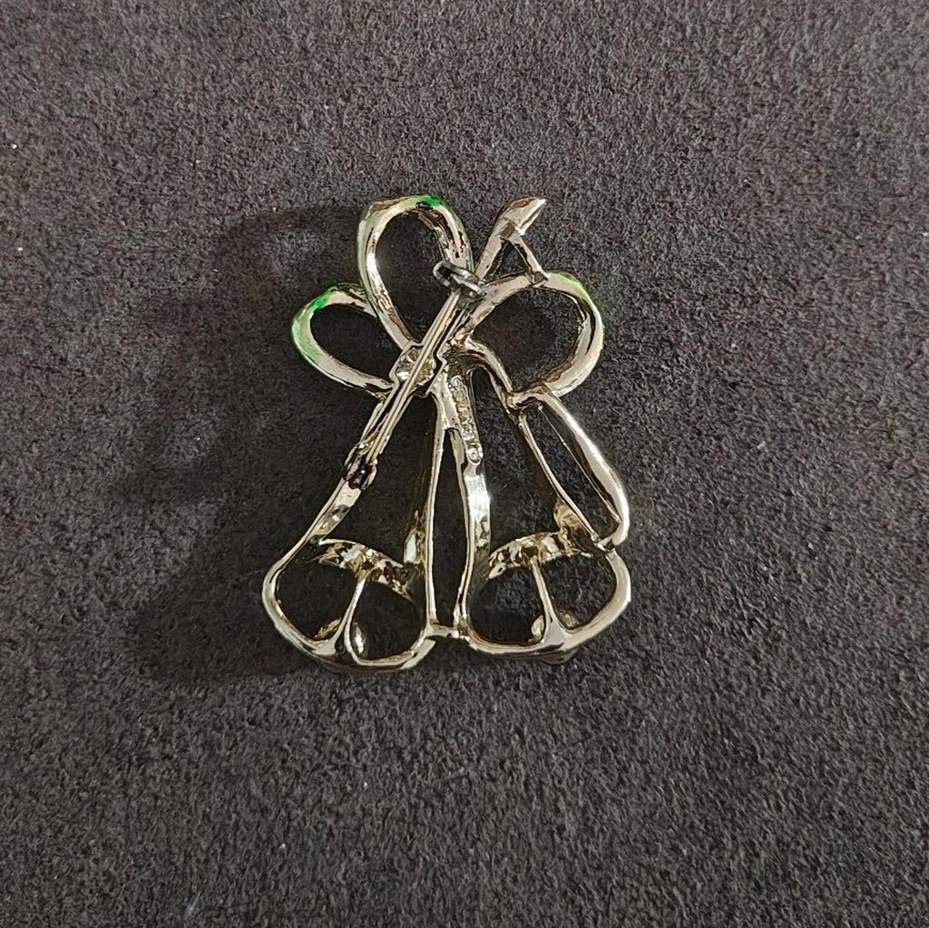 Gold-tone Christmas bells brooch pin back view with safety clasp and straight post