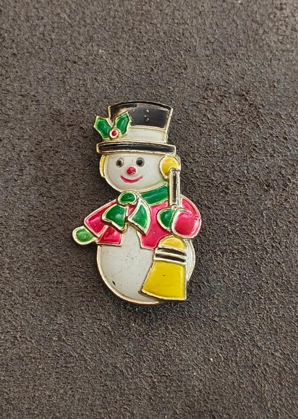 Enamel snowman brooch with green top hat and red arms, full front view