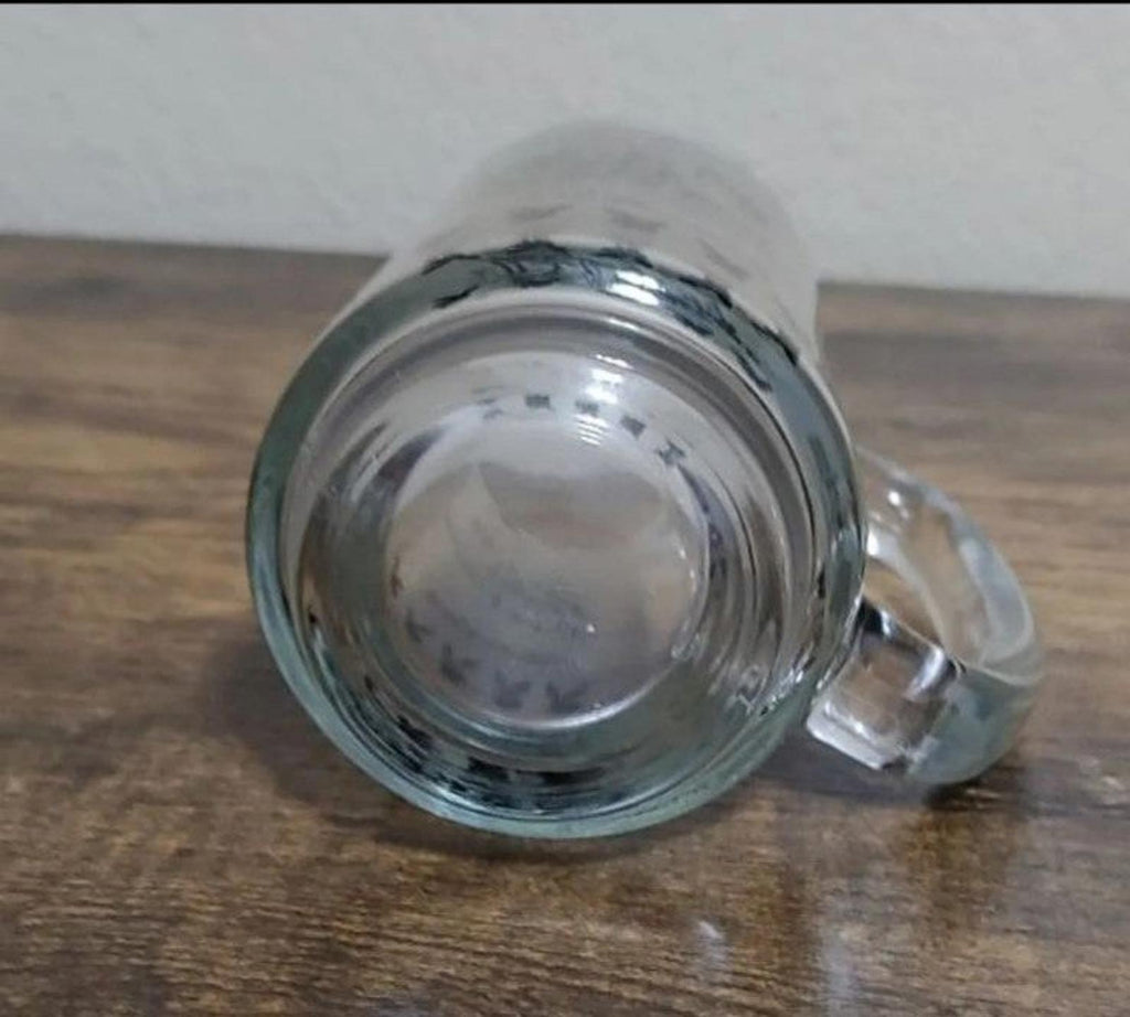 Clear glass mug interior view with visible base and side handle