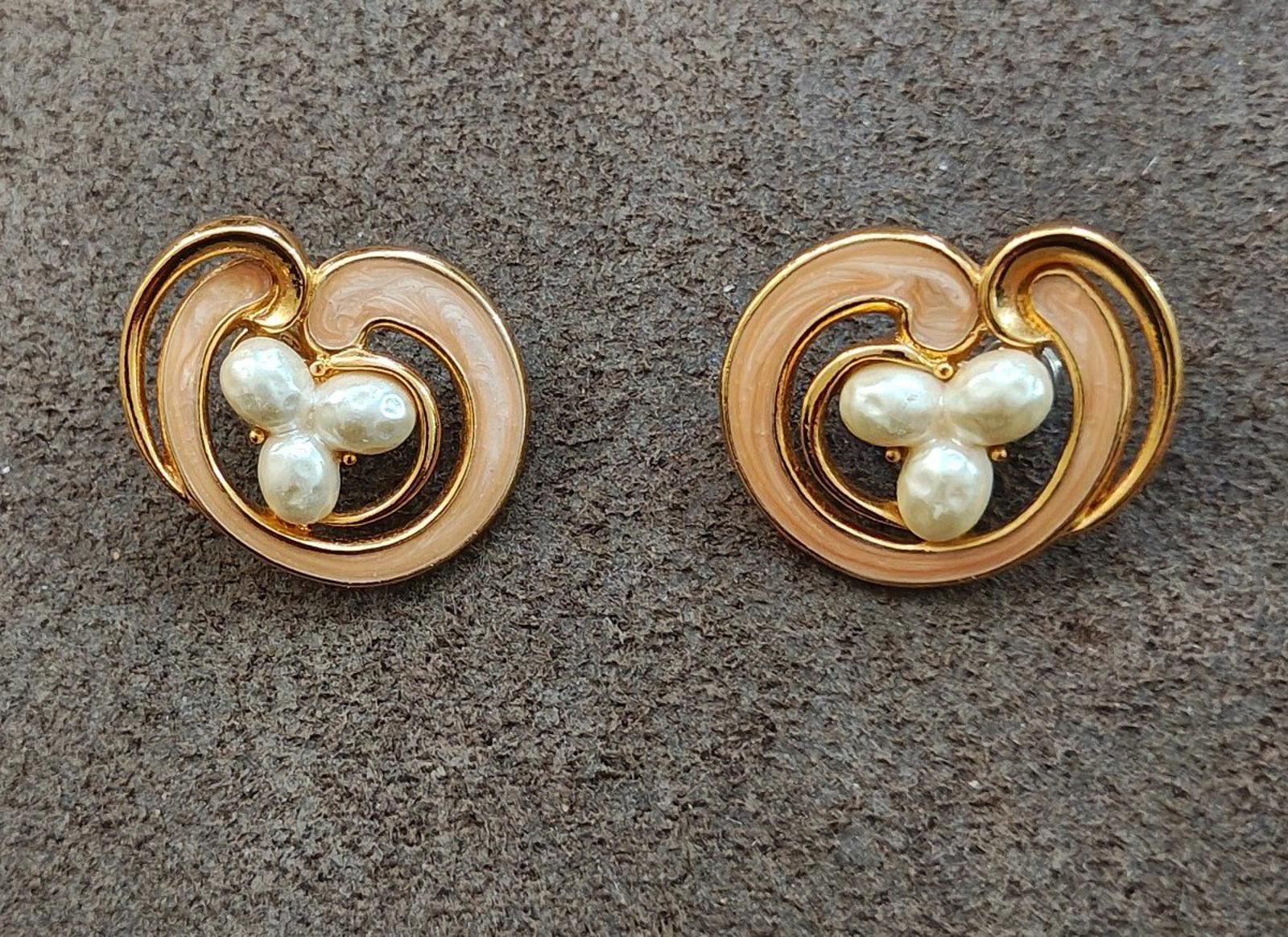 Heart-shaped clip-on earrings with faux pearl cabochon, cream enamel, and gold tone surrounds
