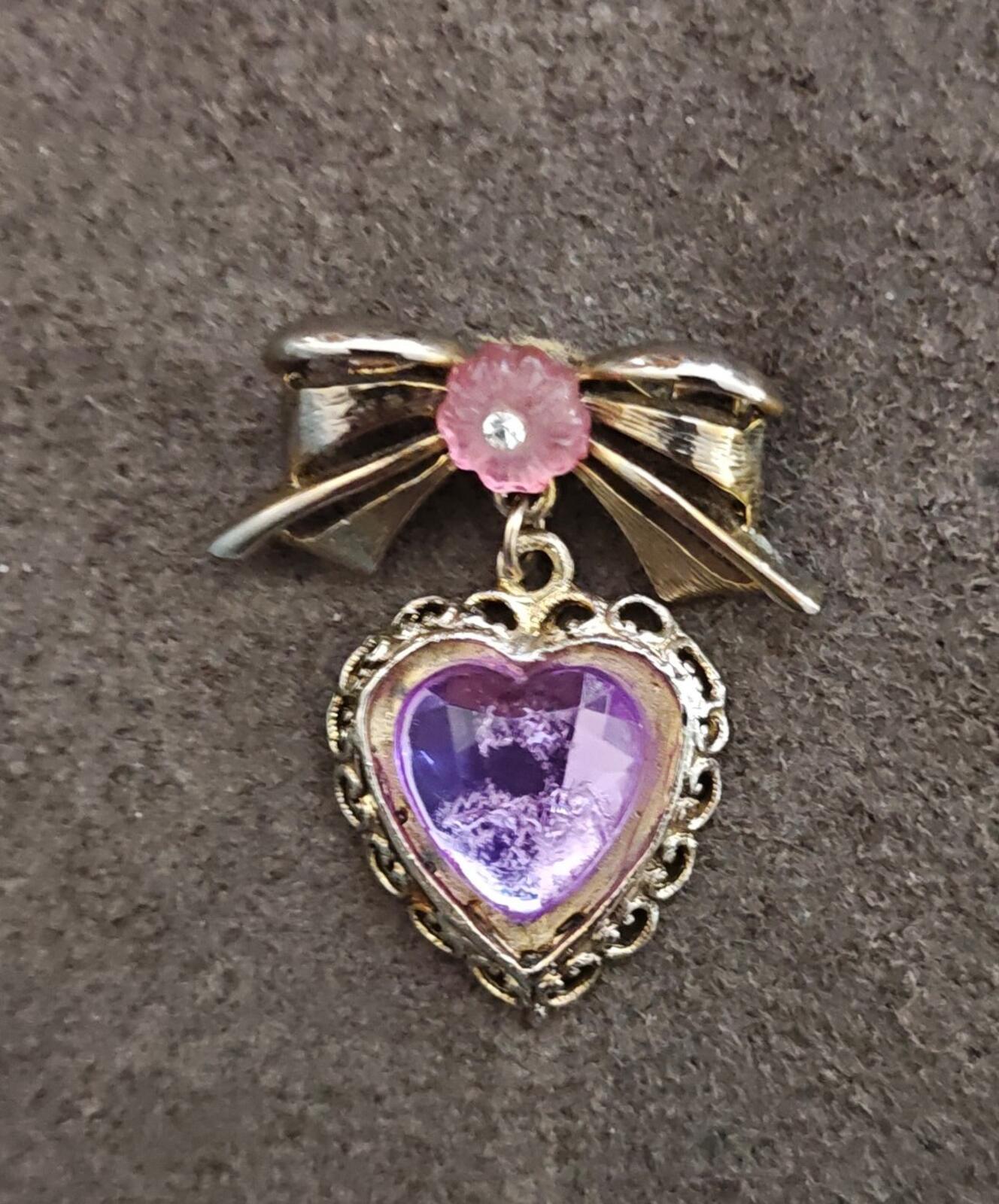 1980s Gold Tone Bow With Pink Flower & Filigree Edged Purple Stone Heart Brooch