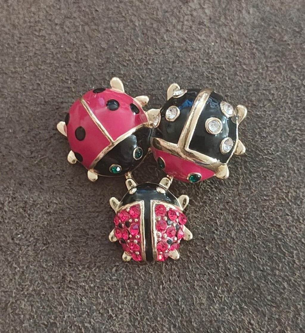 Ladybug trio brooch in red and black enamel with clear rhinestones and gold-tone framing