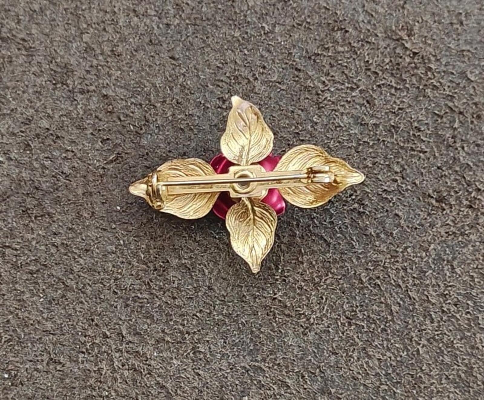 Gold-tone rose enamel brooch with red center and horizontal pin bar backing