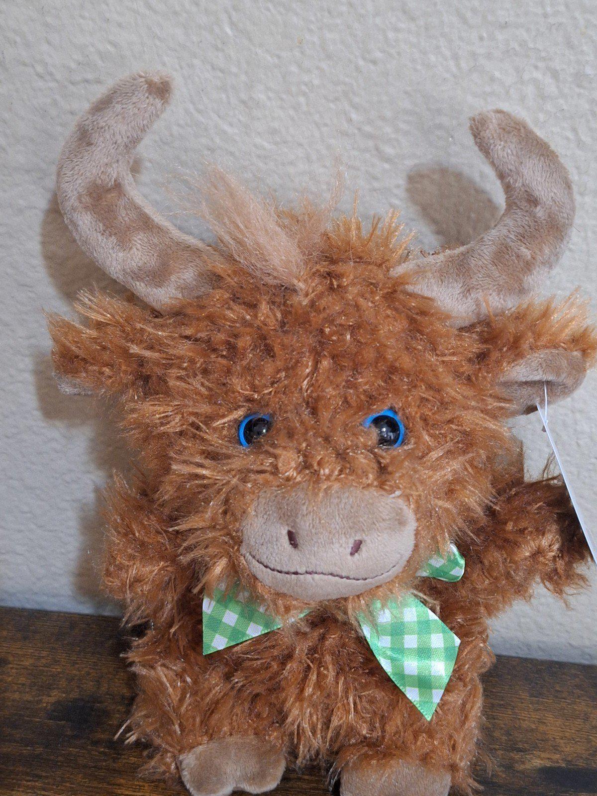 Brown Easter shaggy bull plush with blue eyes and green gingham bow, front view