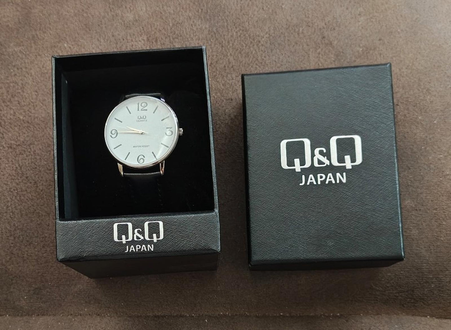 Q&Q Men's Analog Wrist Watch With White Dial and Black Leather Band.