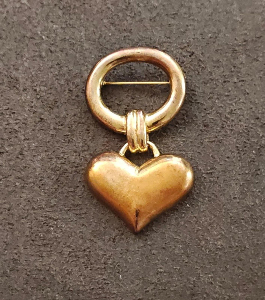 Gold-tone puffy heart brooch charm with circular loop clasp and pin bar