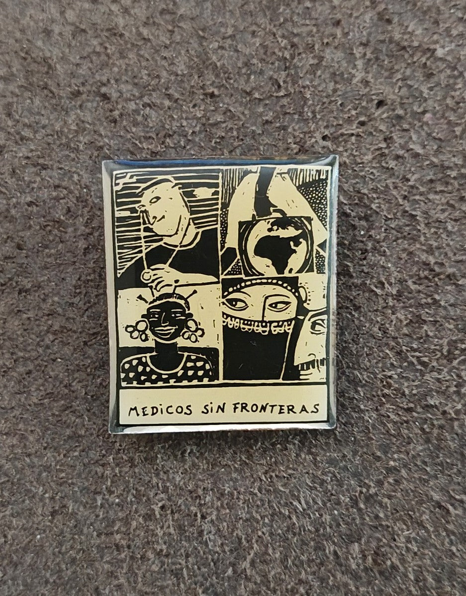 1990s Médicos Sin Fronteras (Doctors Without Borders) Silver Tone Enamel Pin
