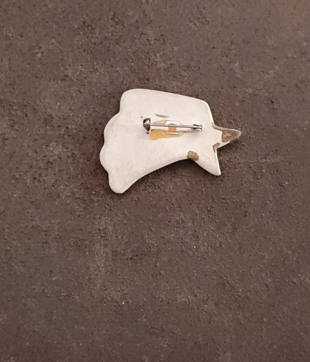 Ceramic shooting star pin brooch back view with metal pin clasp and star backing
