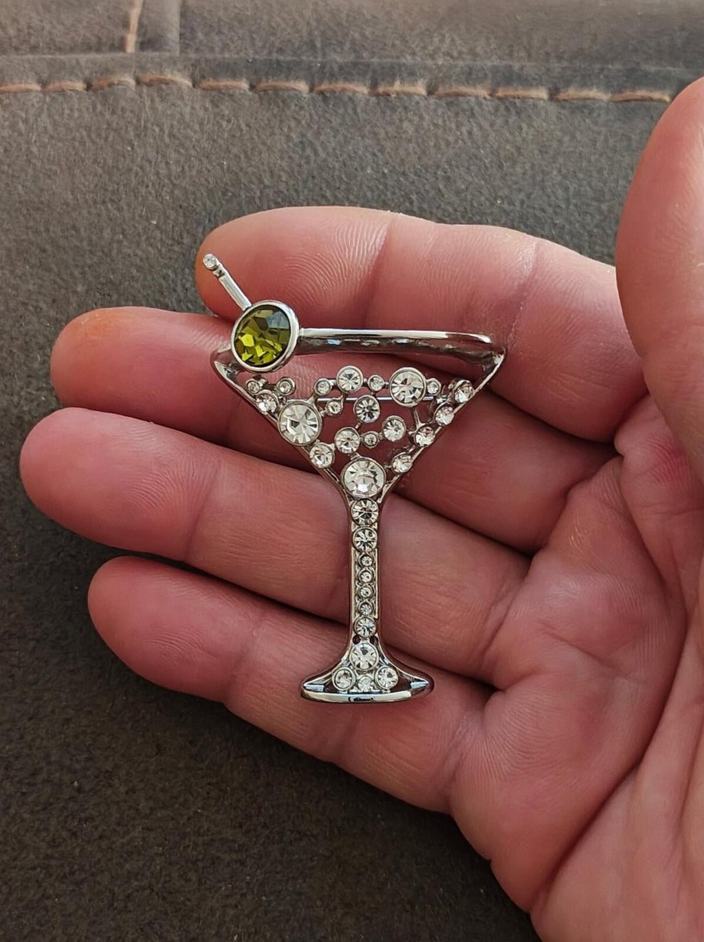 Martini glass brooch in silver tone with green rhinestone top and clear crystals