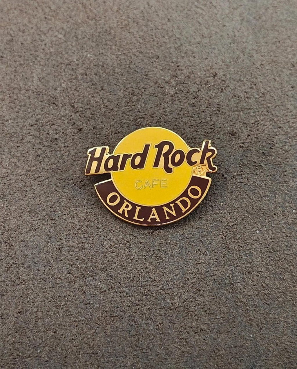 Hard Rock Cafe Orlando gold-tone enamel pin, yellow circle with 'Hard Rock' and 'ORLANDO'