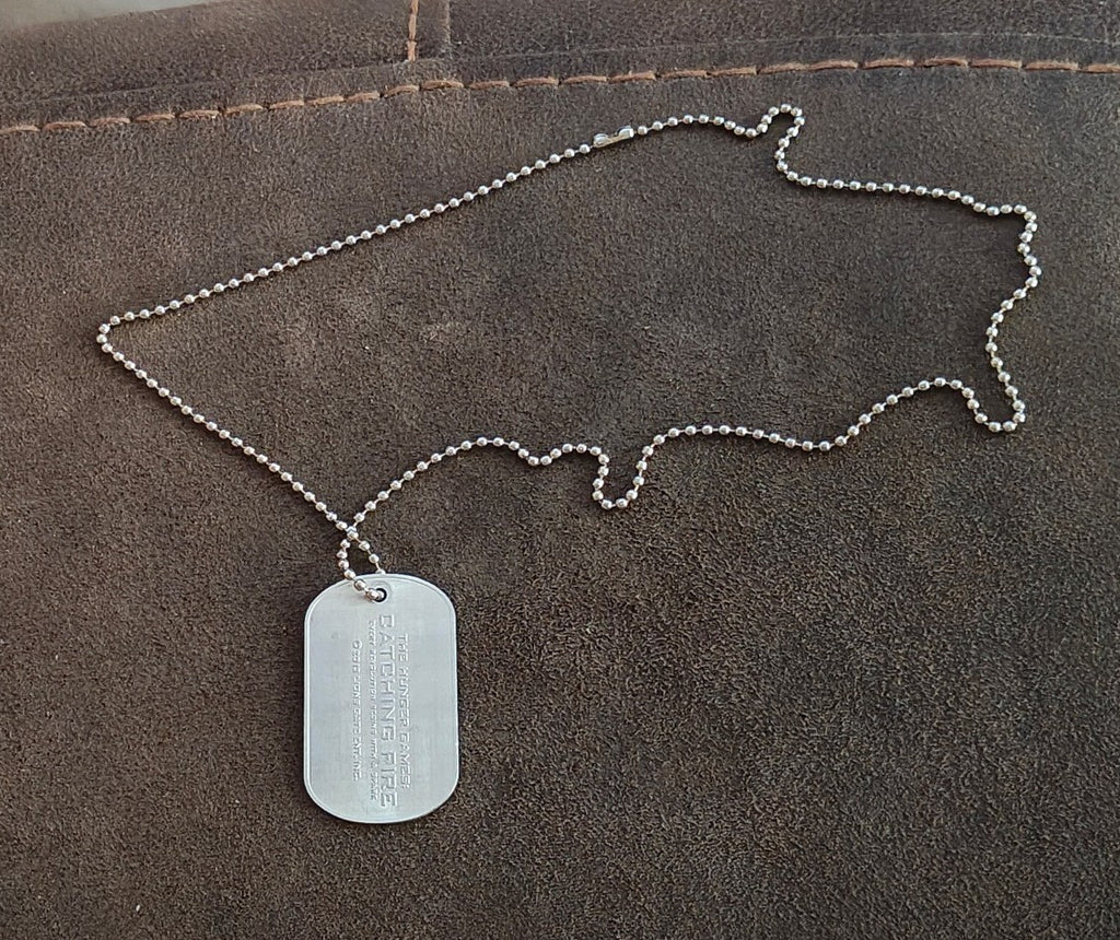 Promotional "The Hunger Games: Catching Fire" District 12 Victor Dog Tag